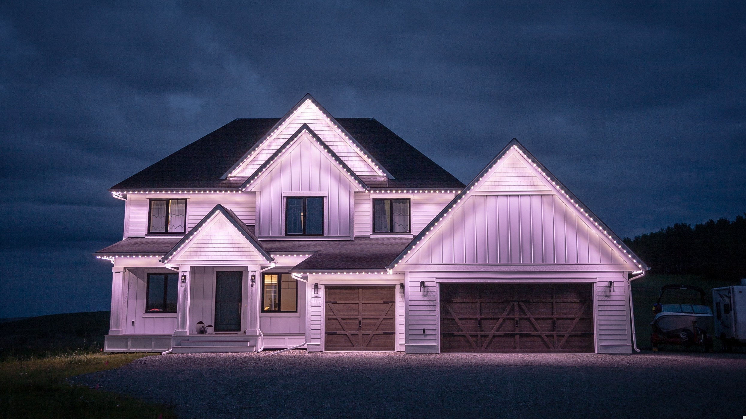 Luxury LED lighting installation on modern farmhouse